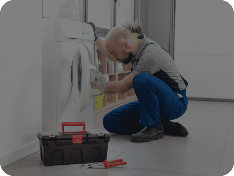 Technician working on appliance